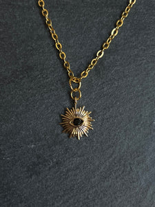 Gold plated Brass sun and black eye necklace