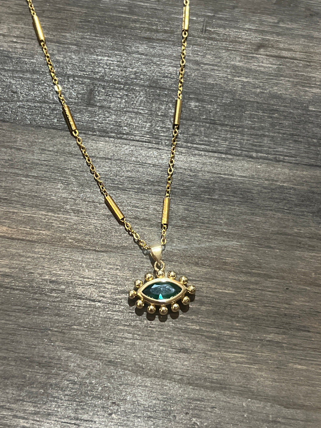 Green eye necklace