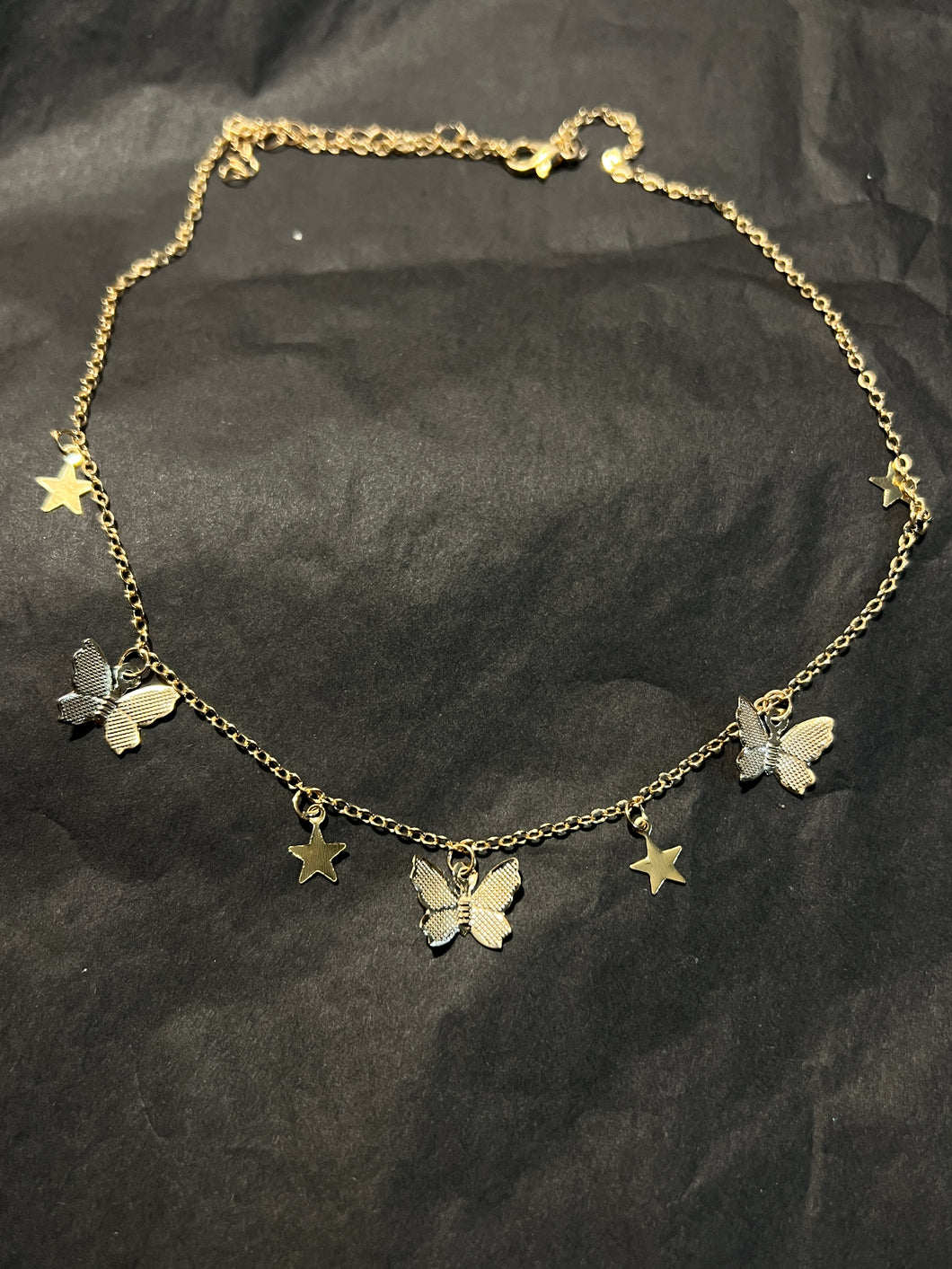 Butterfly star charm necklace